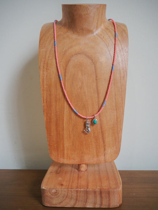 Beaded necklace with mermaid and turquoise pendants